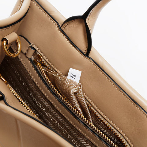 PRADA Symbol Topstitch Handbag beige WS20218