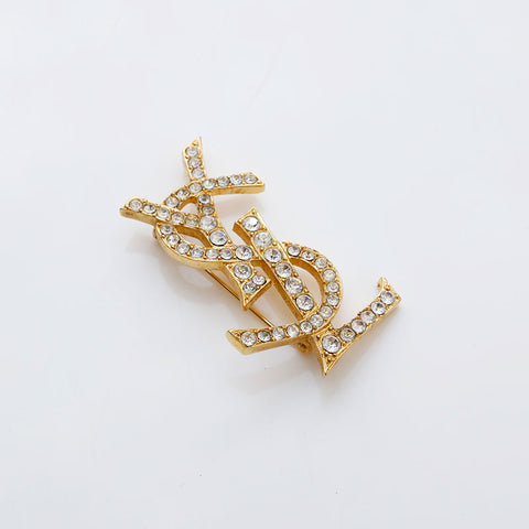イヴ・サンローラン YVES SAINT LAURENT ラインストーン ロゴ ブローチ ゴールド WS22092