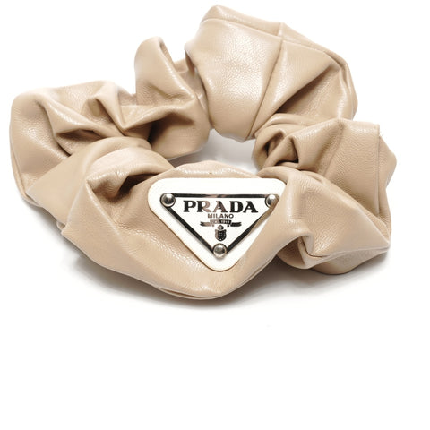 PRADA Leather scrunchie with triangle logo hair accessory beige WS24921