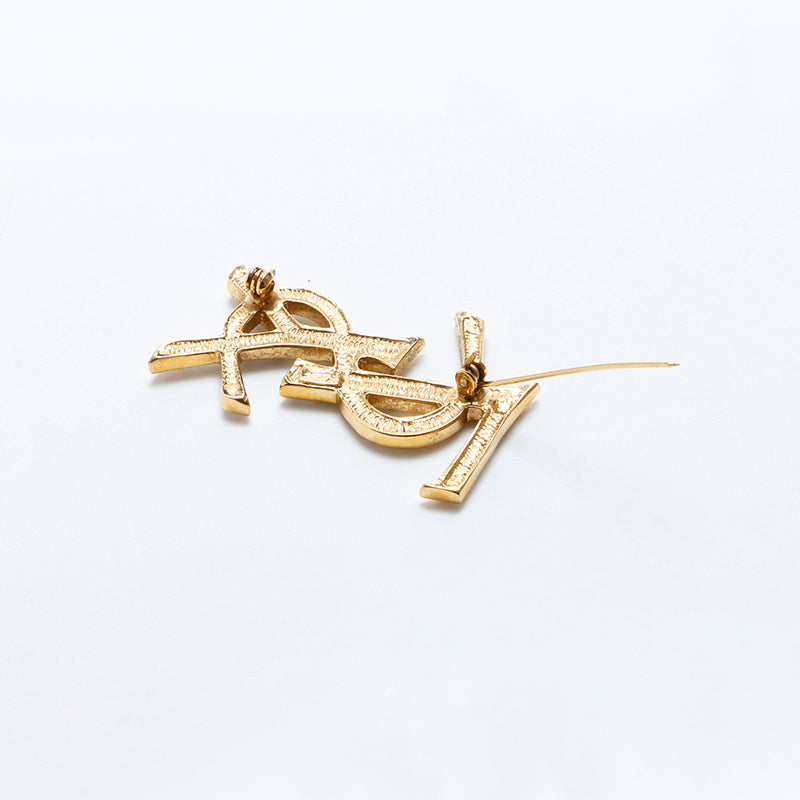 美品　イヴ・サンローラン　ブローチ　ゴールド　ラインストーン イヴ・サンローラン YVES SAINT LAURENT YSL ロゴ ライン